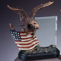 10 INCH ELECTROPLATED BRONZE EAGLE ON PAINTED AMERICAN FLAG WITH 4 X 6 INCH GLASS TROPHY