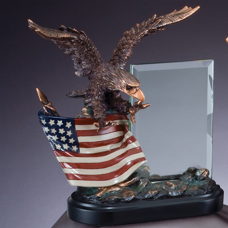 10 INCH ELECTROPLATED BRONZE EAGLE ON PAINTED AMERICAN FLAG WITH 4 X 6 INCH GLASS TROPHY