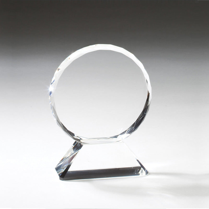 6 INCH CRYSTAL BEVELED AND FACETED CIRCLE ON TRIANGULAR BASE.