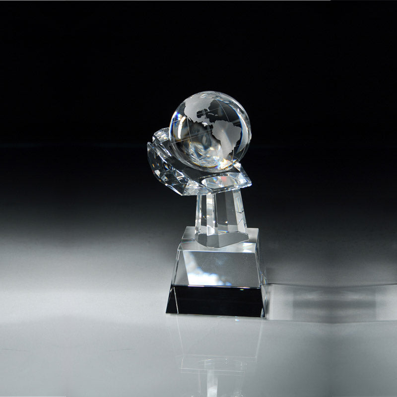 8 1/2"x 3 1/2" INCH CRYSTAL GLOBE IN HAND ON SLANTED BLACK BASE